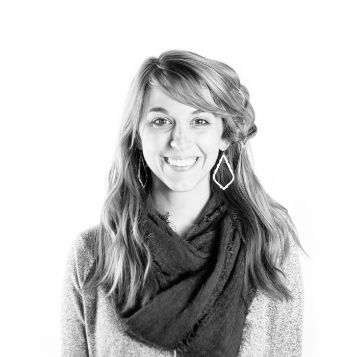 A scarf-clad woman in a monochrome photograph.